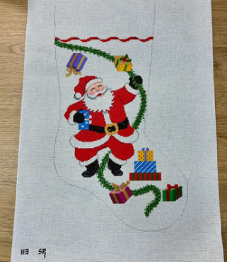 113 SR- Susan Roberts Santa with Garland and Presents, Stocking